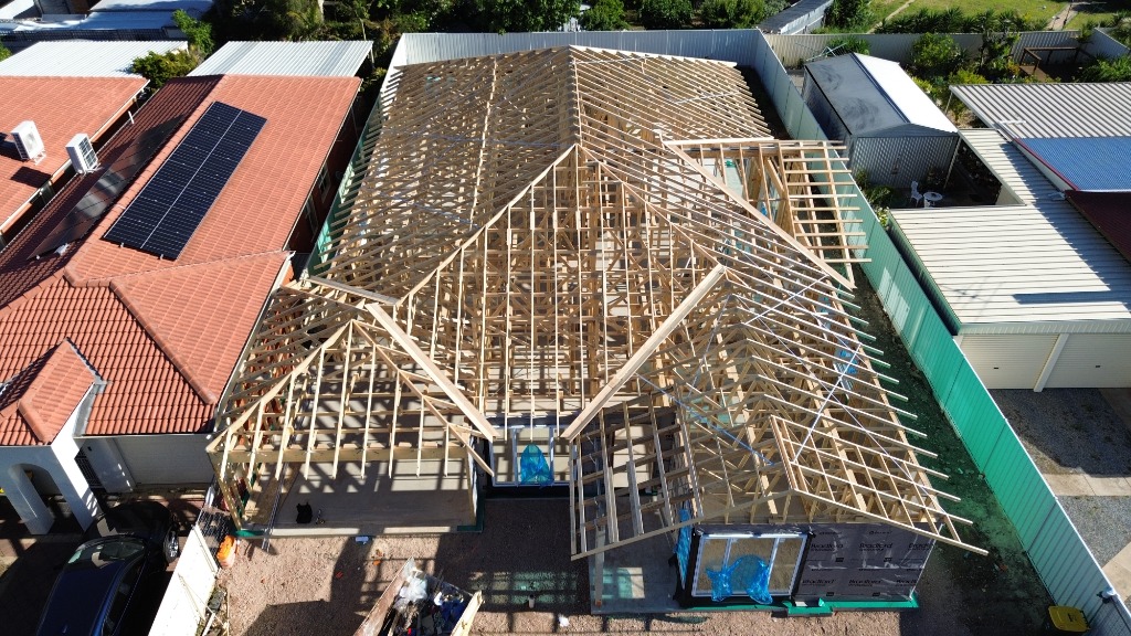 Complete frame stage inspection showing timber trusses